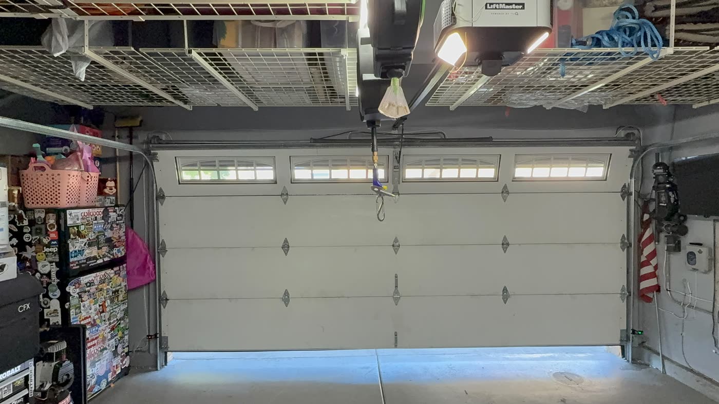 Same garage door repaired, closed and rolling straight again