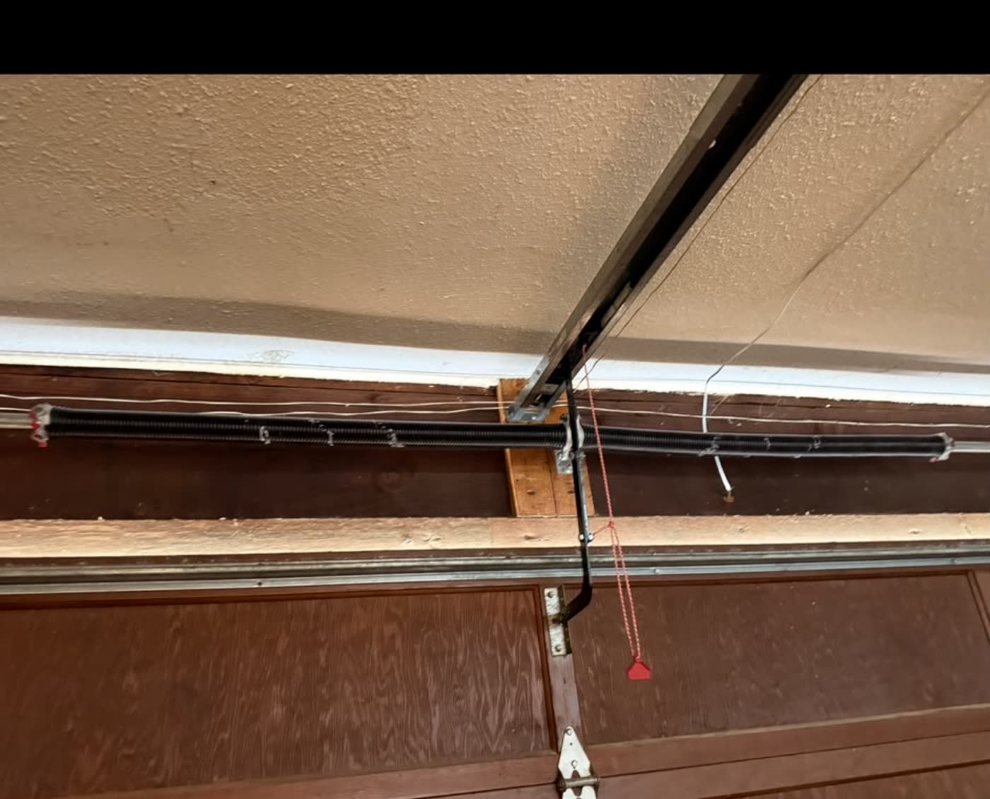 New torsion springs installed and balanced on the same wooden garage door