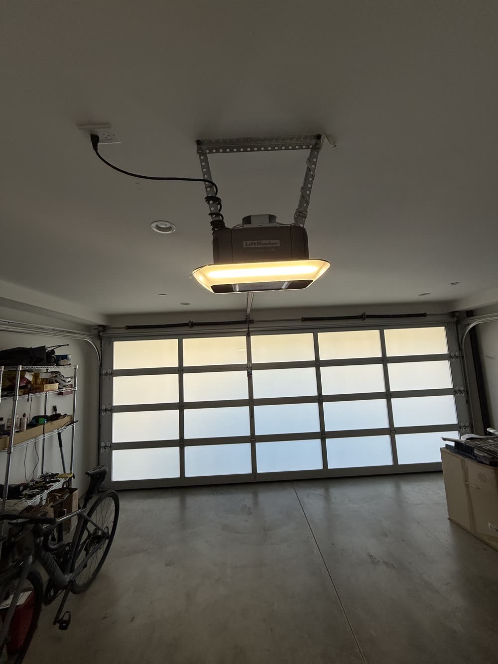 Frosted glass garage door with new opener, complete setup